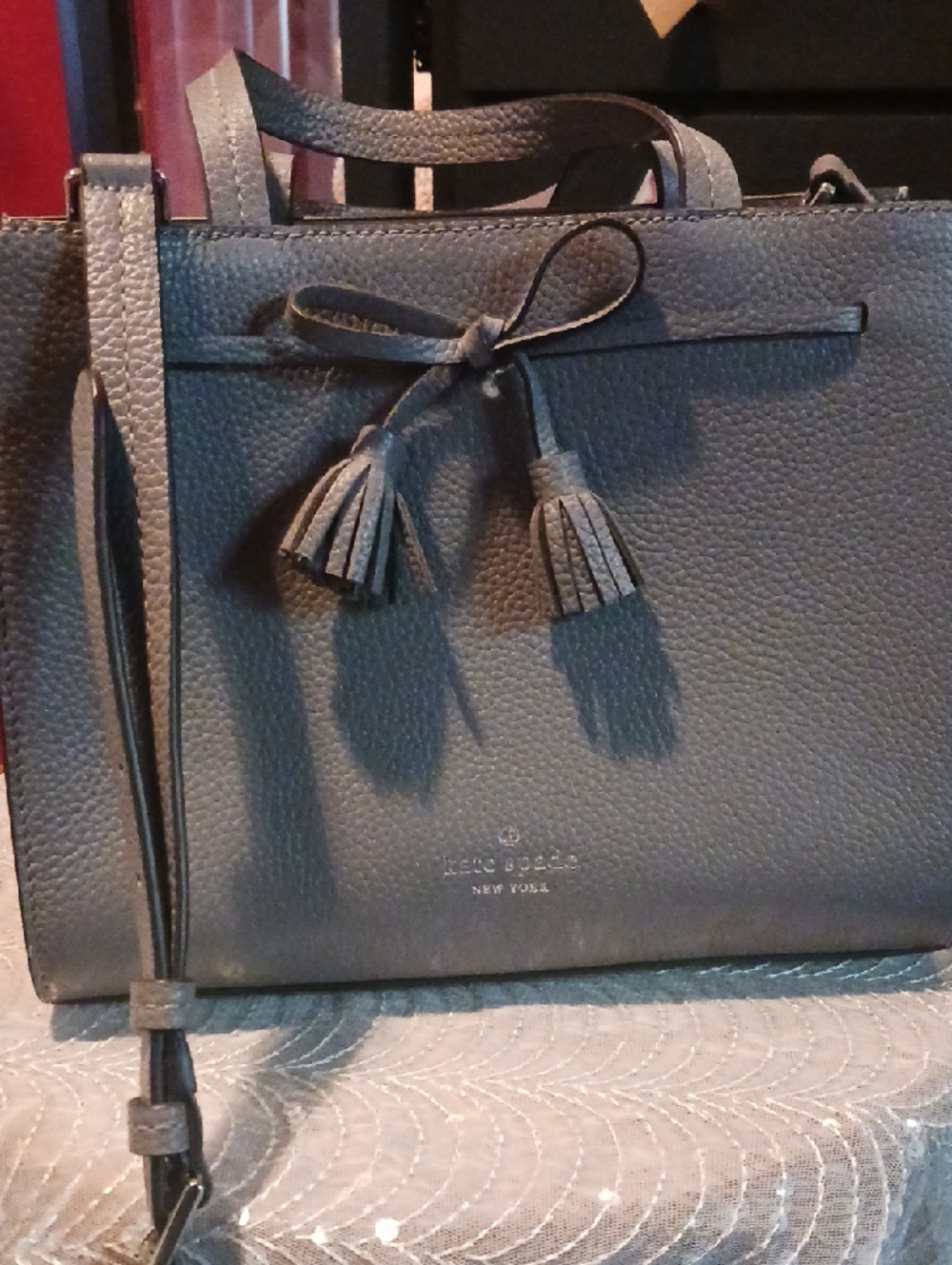 kate spade gray pebbled leather crossbody with tassel bow